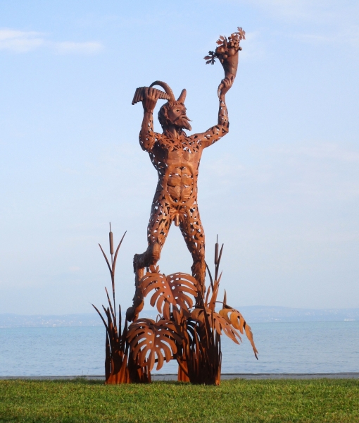 Pan statuette rusty iron